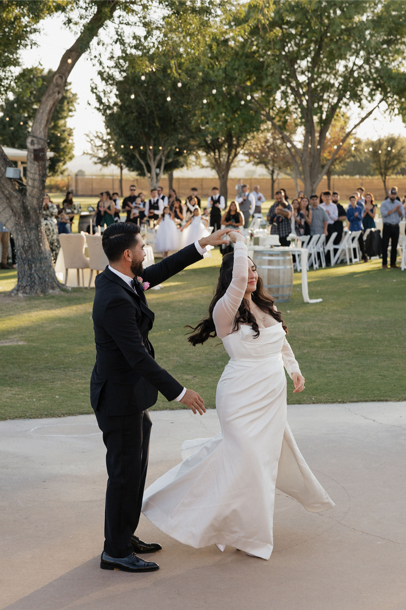 Groom spins bride on the dance floor at La Vina Winery.