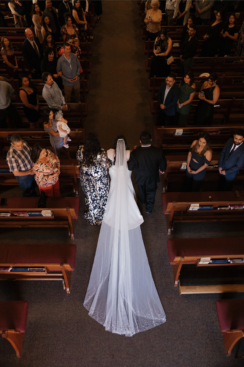 A photographer was able to book dream clients that wanted an aerial photo of their ceremony as the bride was walked down the aisle by both parents.